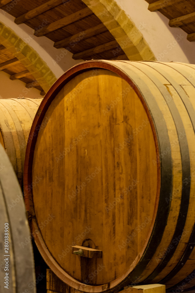 Vintage wine cellar with old oak barrels, production of fortified dry or sweet marsala wine in Marsala, Sicily, Italy