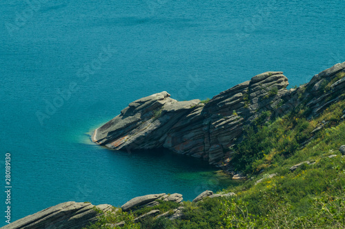 rocky cape on a mountain lake