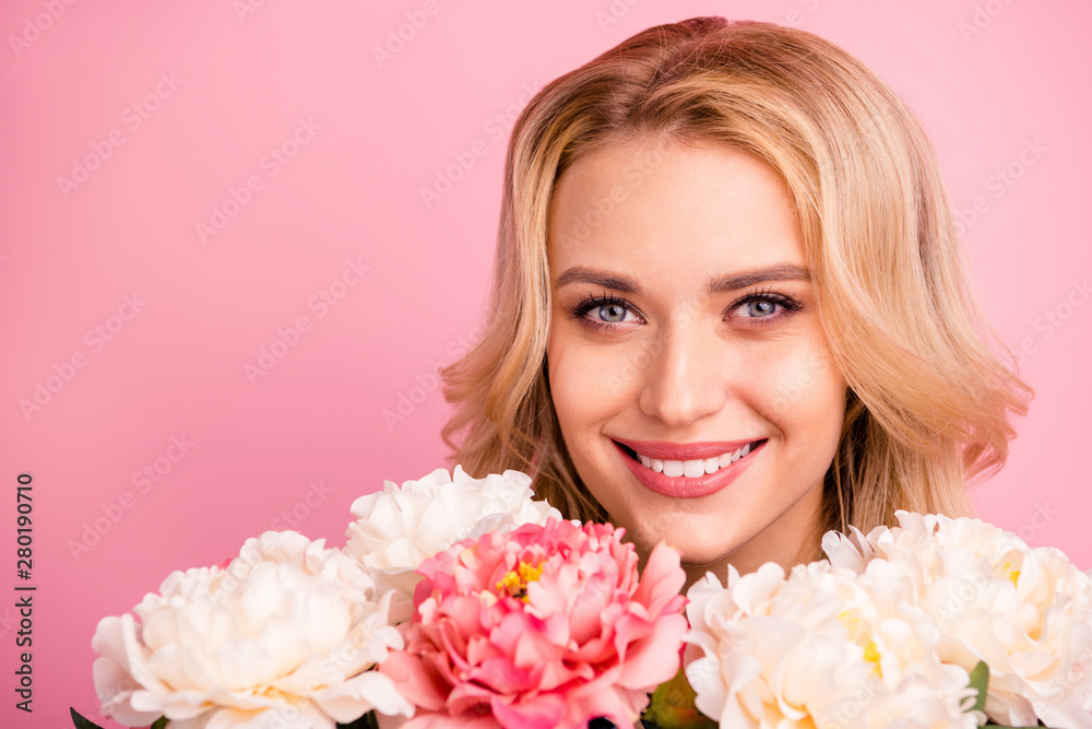 Close-up cropped portrait of her she nice attractive lovely shine lovable sweet gorgeous cheerful cheery wavy-haired girl with colorful flowers isolated over pink pastel background