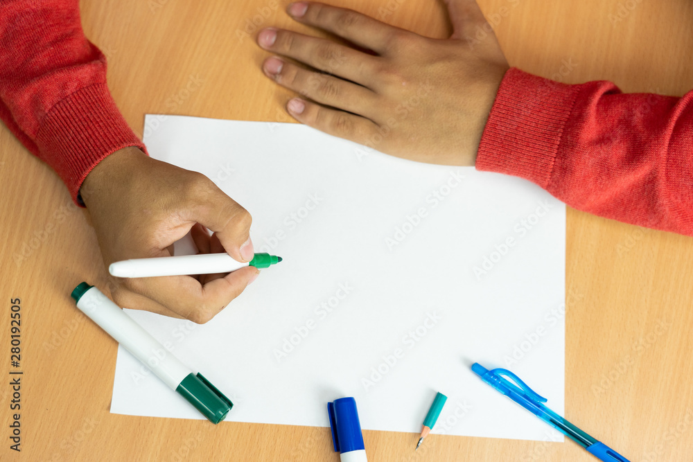 teenager with a felt-tip pen in her fingers prepared for study