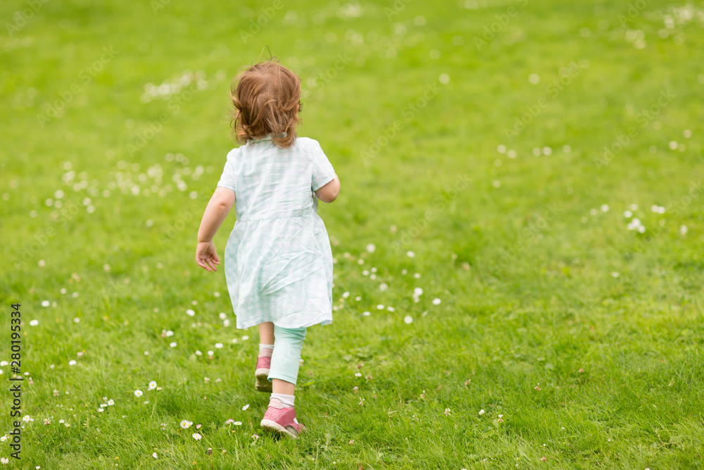 childhood, leisure and people concept - happy little baby girl running at park in summer childhood, leisure and people concept - happy little baby girl running at park in summer