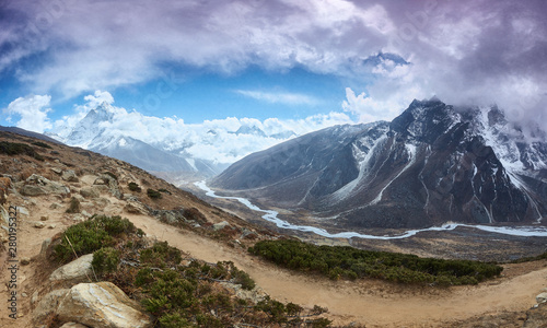 Amphu Gyabjen and Ama Dablan peaks views with clouds, Everest base camp trek, Nepal photo