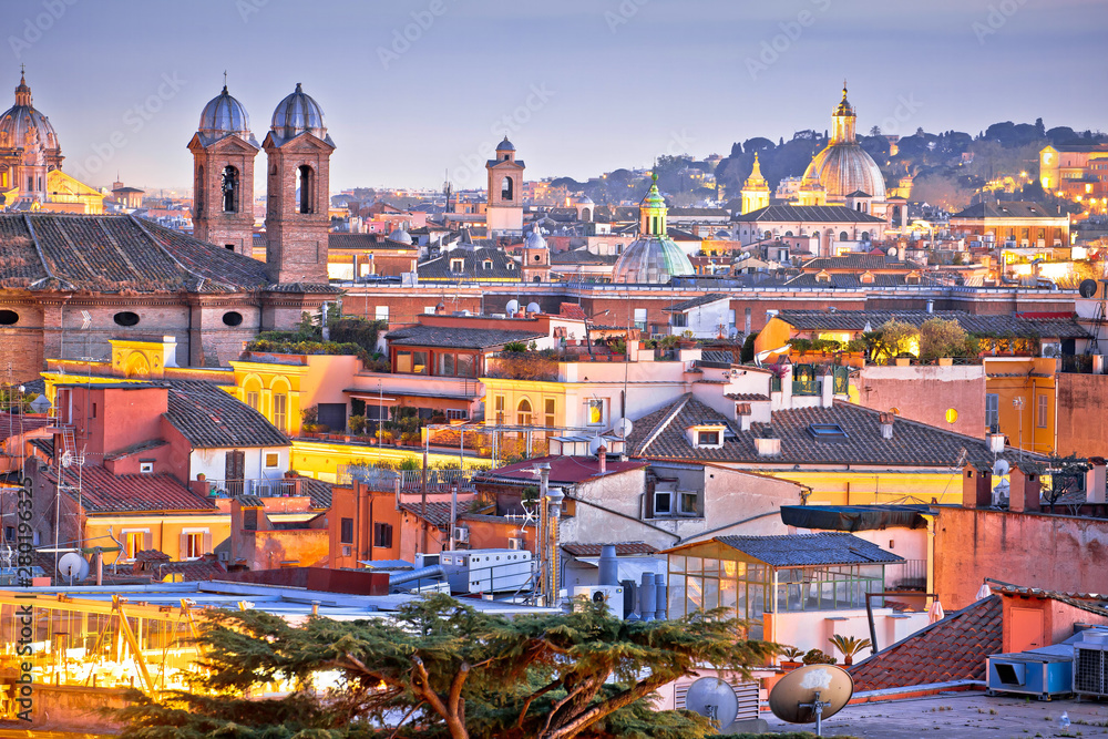 Colorful rooftops of Eternal city of Rome at dusk view