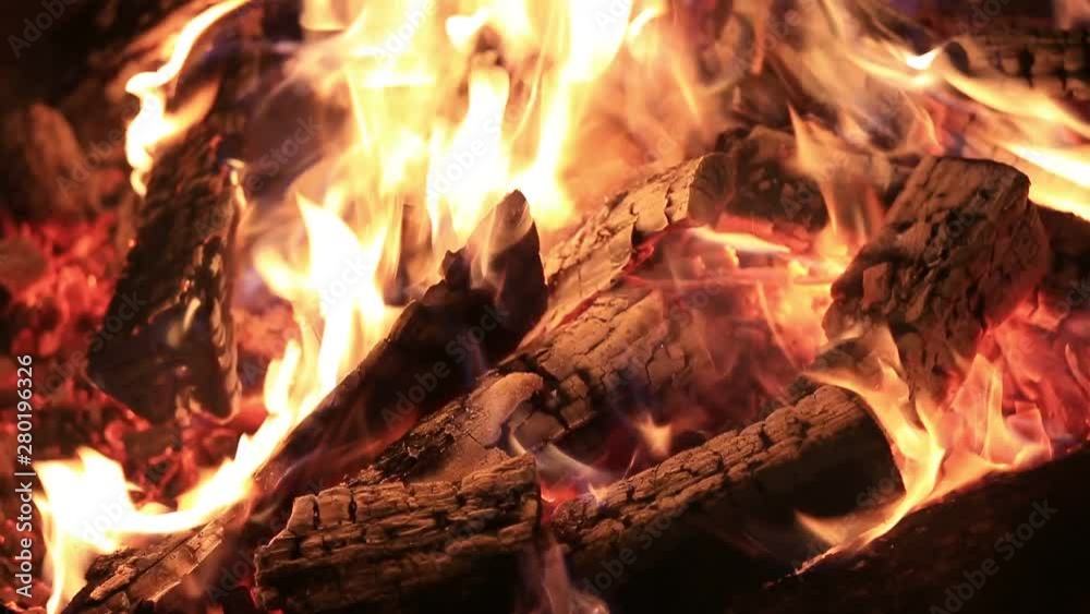 Hot fireplace full of wood and fire burning, closeup Hot fireplace full of wood and fire burning, closeup