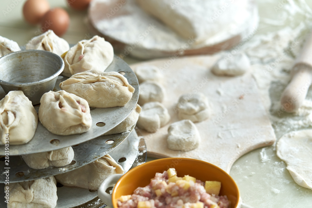 Uzbek national food manta, like dumplings, background of ingredients and semi-finished products Uzbek national food manta, like dumplings, background of ingredients and semi-finished products