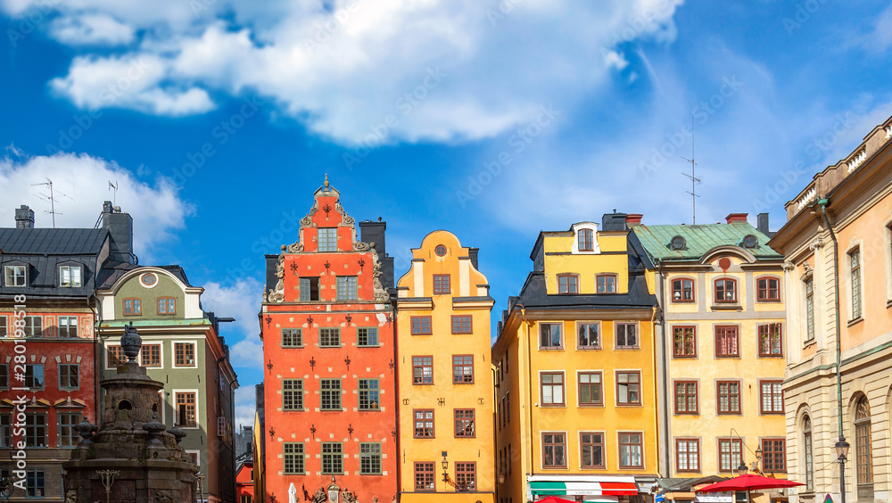 Fototapeta premium Colorful facade of the houses in Stortorget Square Gamla Stan. Stockholm, Sweden at summer sunny day.