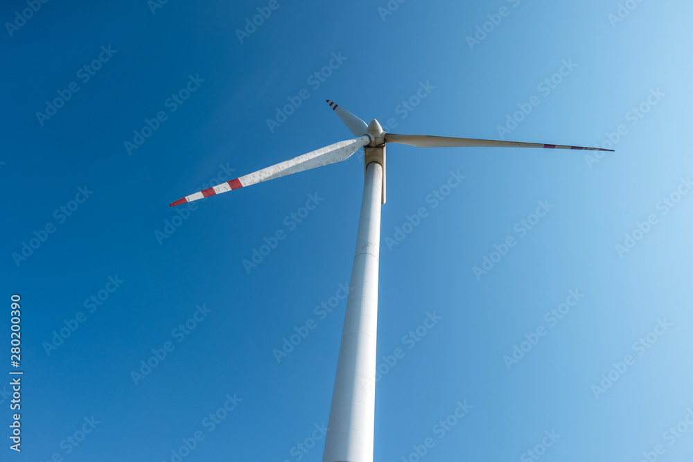 rotating blades of a windmill propeller. Wind power generation. Pure green energy. rotating blades of a windmill propeller. Wind power generation. Pure green energy.