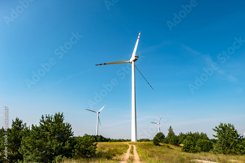 Wallpaper Mural rotating blades of a windmill propeller. Wind power generation. Pure green energy. Torontodigital.ca