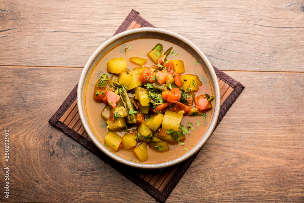 Lauki/doodhi ki Sabji also known as bottle gourd curry. served in a bowl or karahi. selective focus Lauki/doodhi ki Sabji also known as bottle gourd curry. served in a bowl or karahi. selective focus