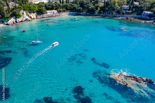 Aerial view of turquoise sea water and rocks by the seashore. © magdal3na