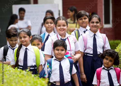 Group of schoolboys and schoolgirls at school campus