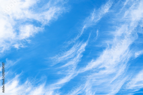 blue sky with spindrift clouds in summer afternoon