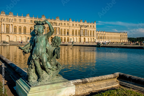 Statue and Palace of Versailles on the background, Versailles, France
