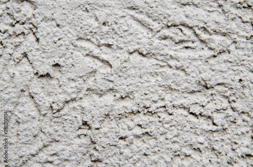 The texture of the facade putty grey walls