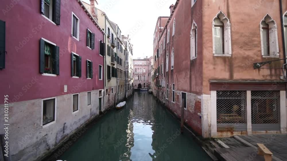 Venice, Italy, Authentic Venetian Water Canal Between Colored Buildings Venice, Italy, Authentic Venetian Water Canal Between Colored Buildings