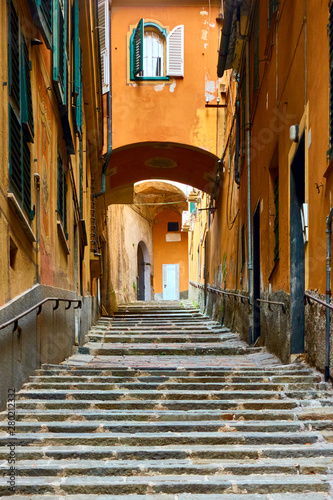 Fototapeta Naklejka Na Ścianę i Meble -  Uphill street with stairs in Genoa