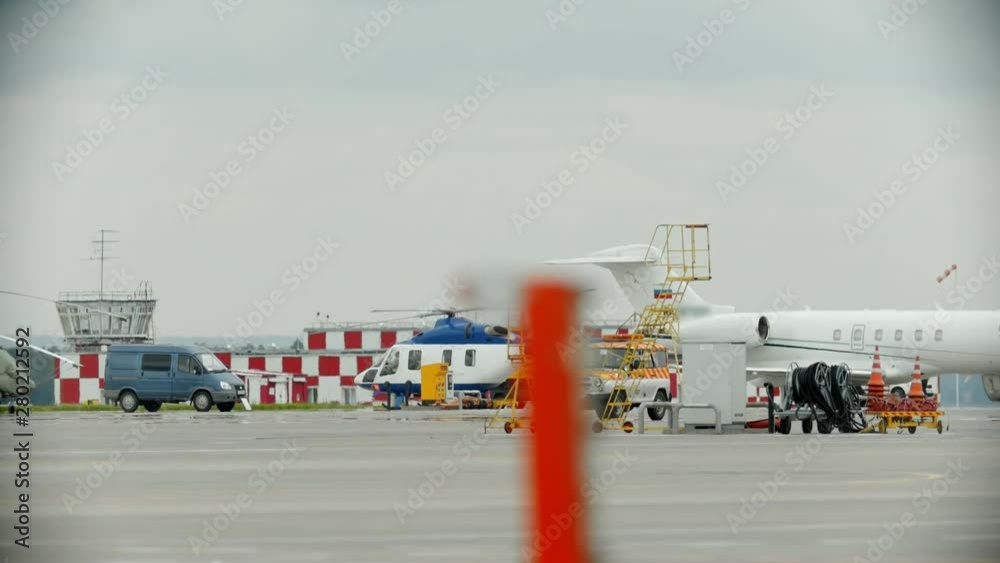 An airport field - helicopter about to take off An airport field - helicopter about to take off