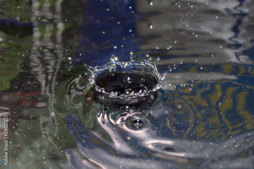 color photo of a water droplet splash front view © Gazed