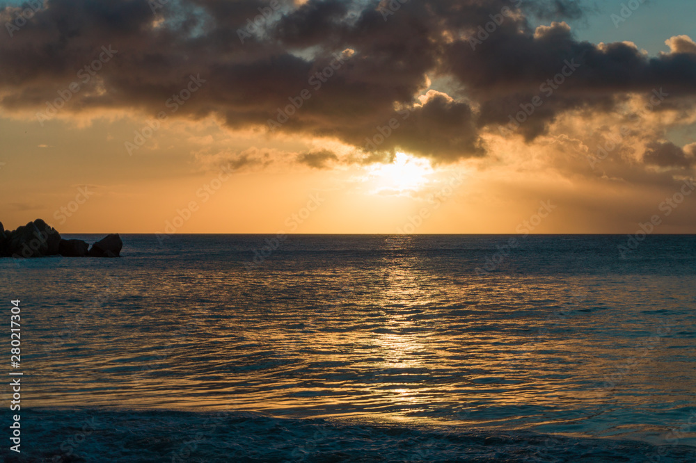 Fototapeta premium Sunset at a sandy beach in Seychelles