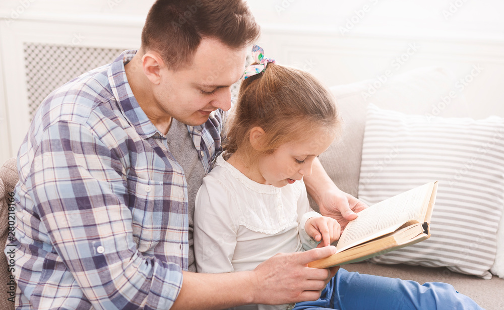Little girl is learning how to read Little girl is learning how to read