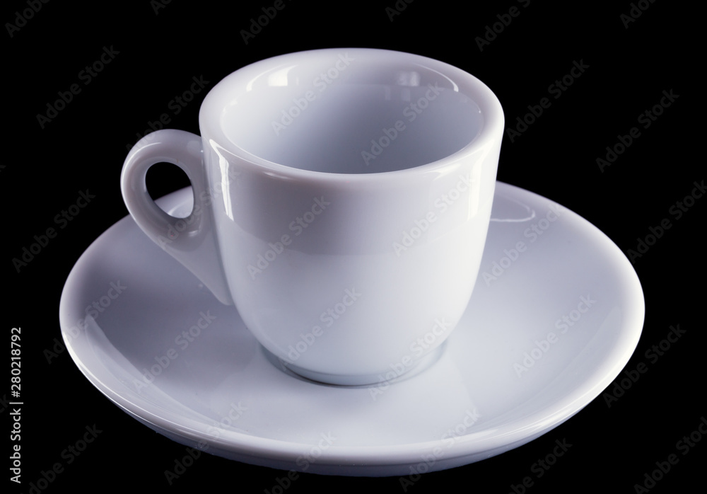 White porcelain cup and saucer for coffee, on a dark background, no body. White porcelain cup and saucer for coffee, on a dark background, no body.