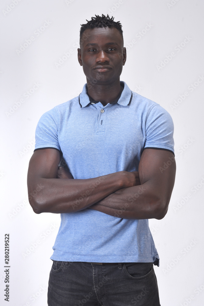 Fototapeta premium portrait of a man with arms crossed on white background