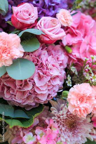 Pink and purple hydrangea  eucalyptus  pink roses  carnations and chrysanthemums.