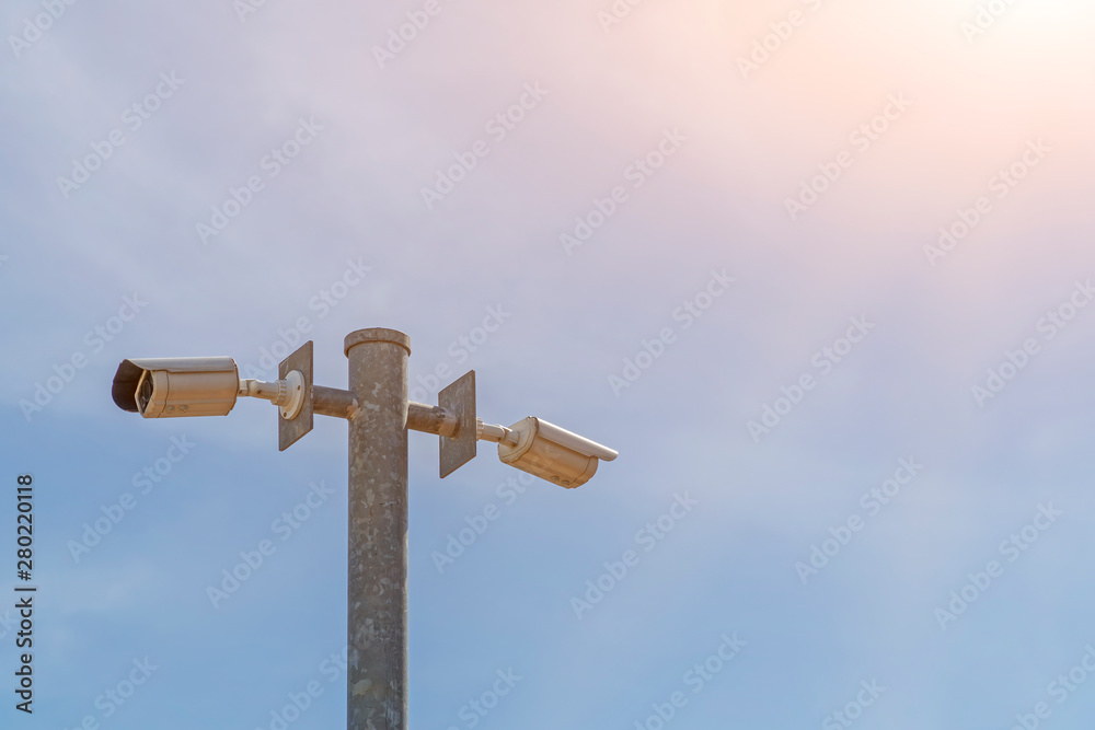 CCTV on the pole with blue sky background CCTV on the pole with blue sky background