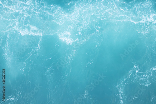 Sea Waves in ocean wave Splashing Ripple Water. Blue water background. Leave space for writing messages.