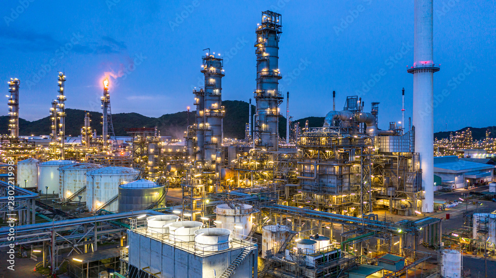 Aerial view petrochemical plant and oil refinery plant background at night,  Petrochemical oil refinery factory plant at night.