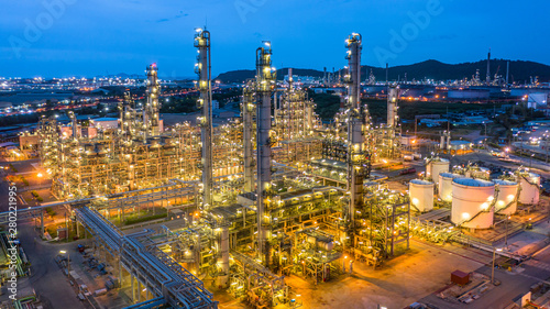 Aerial view petrochemical plant and oil refinery plant background at night,  Petrochemical oil refinery factory plant at night.
