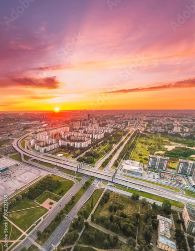 Bright sunset over the city, aerial view from a height. © aapsky