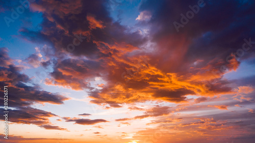 Dramatic orange sky with clouds at sunset