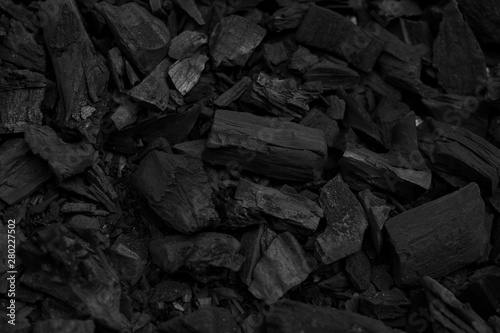 Black charcoal pieces texture background for barbeque