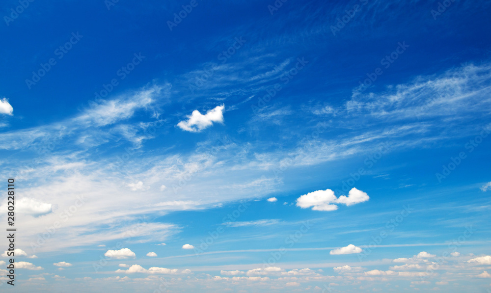 white clouds against blue sky