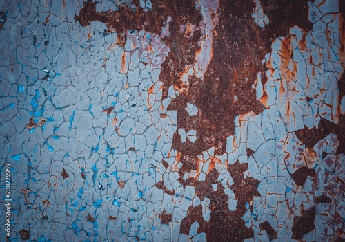 Texture of old paint covered with cracks and rust