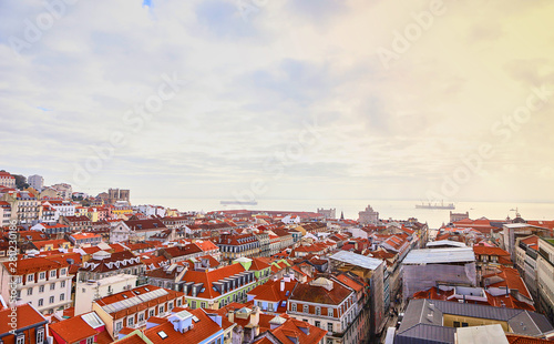 Lisbon Portugal - Beautiful panoramic view of the red roofs of houses in antique historical district Alfama and bridge from Sao Jorge Castle