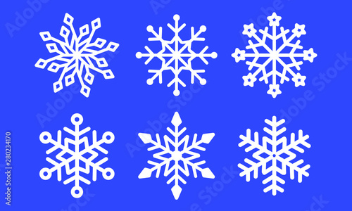 Set of laser cutting openwork snowflakes. Christmas decoration. Template for cut out paper snowflake isolated on blue background. Vector silhouette, stencil for scrapbooking, woodcut, carved wood.