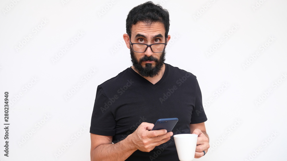 Middle age man in a white backround holding a cup of coffee Middle age man in a white backround holding a cup of coffee