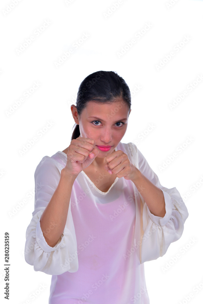 Young businesswoman giving punch over isolated white background Young businesswoman giving punch over isolated white background