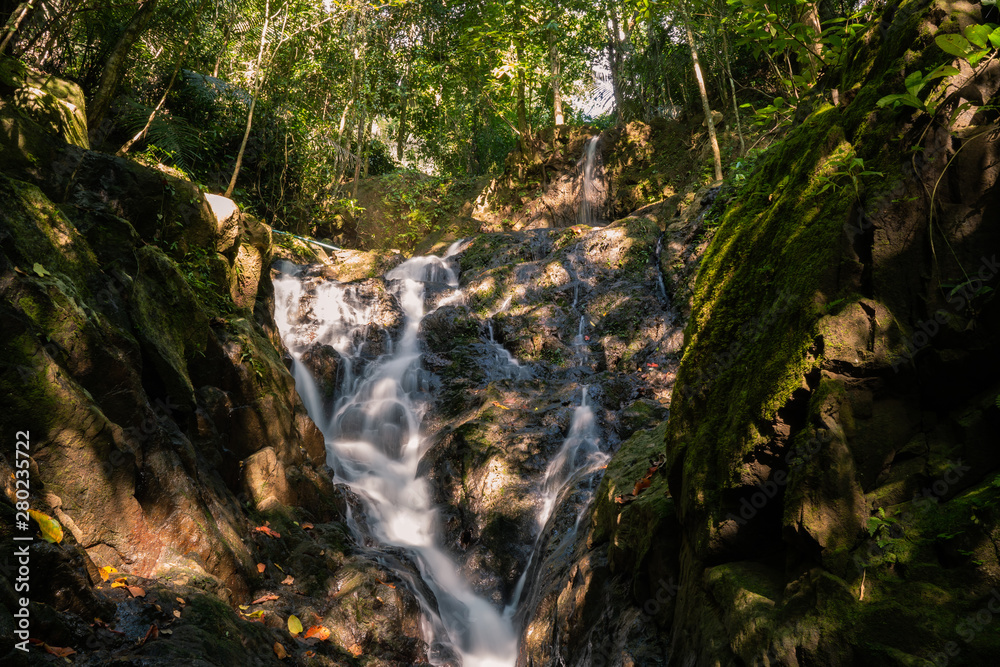 Ton Sai Waterfall in the tropical forest area In Asia, suitable for walks, nature walks and hiking, adventure photography Of the national park Phuket Thailand. Ton Sai Waterfall in the tropical forest area In Asia, suitable for walks, nature walks and hiking, adventure photography Of the national park Phuket Thailand.