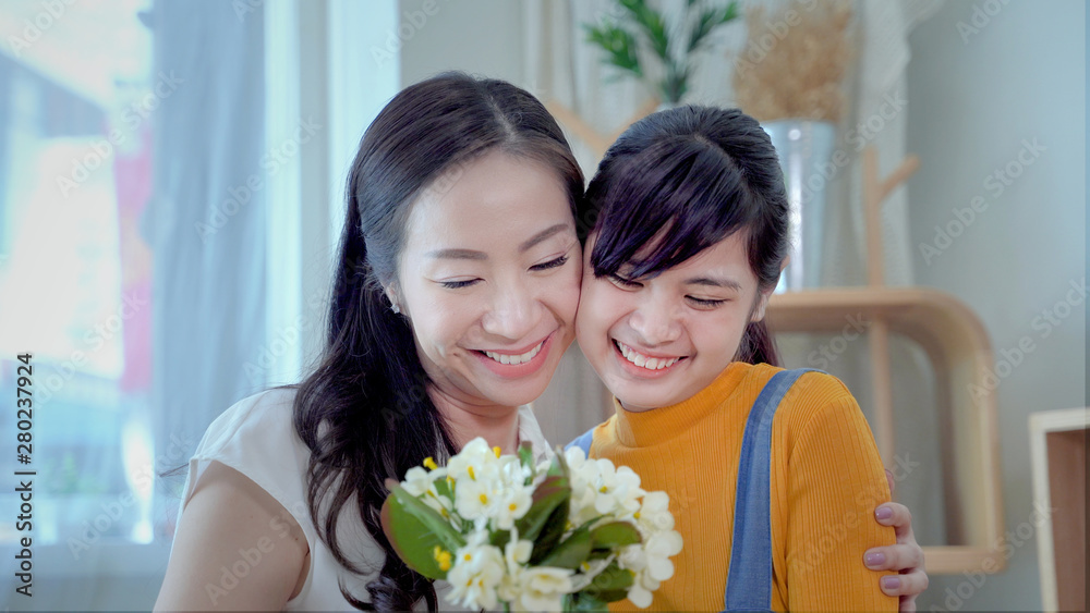 Family concept, mother and daughter are showing love each other by hugging. South East Asian families Family concept, mother and daughter are showing love each other by hugging. South East Asian families
