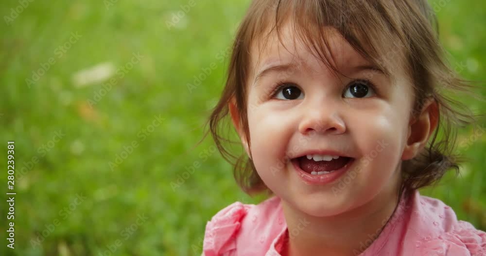 Cute baby girl exploring a park in summer. Real life, candid 4K footage. Cute baby girl exploring a park in summer. Real life, candid 4K footage.