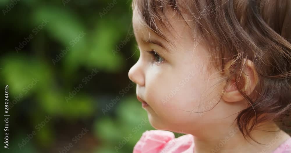 Cute baby girl exploring a park in summer. Real life, candid 4K footage. Cute baby girl exploring a park in summer. Real life, candid 4K footage.