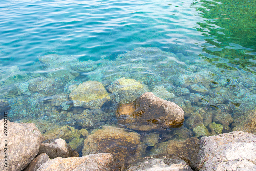 Adriatic sea water and stones on the shore, Porat, Krk island, Croatia