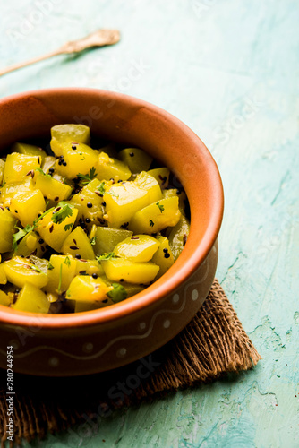 Lauki/doodhi ki sookhi Sabji also known as bottle gourd dry vegetable recipe. served in a bowl or karahi. selective focus photo