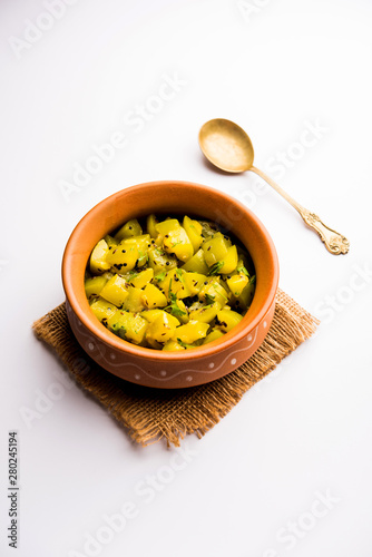 Lauki/doodhi ki sookhi Sabji also known as bottle gourd dry vegetable recipe. served in a bowl or karahi. selective focus photo