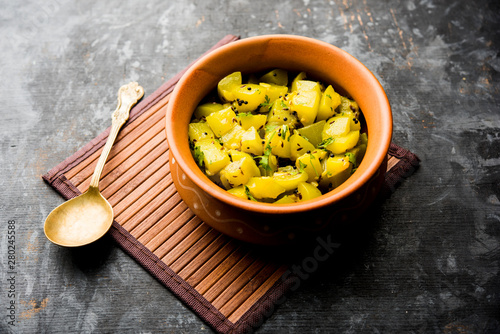 Lauki/doodhi ki sookhi Sabji also known as bottle gourd dry vegetable recipe. served in a bowl or karahi. selective focus photo