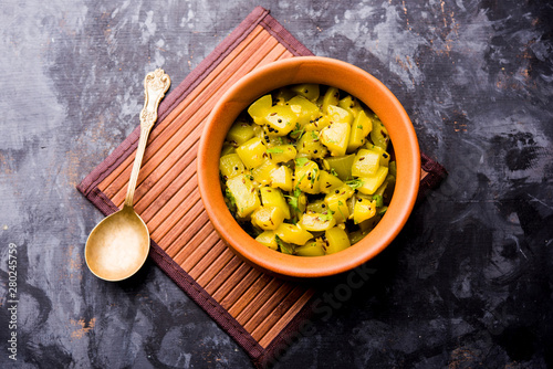 Lauki/doodhi ki sookhi Sabji also known as bottle gourd dry vegetable recipe. served in a bowl or karahi. selective focus photo