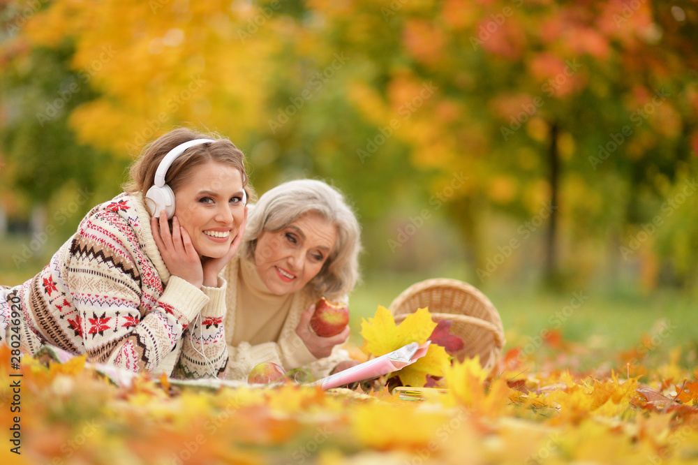 Portrait of senior woman with daughter resting Portrait of senior woman with daughter resting